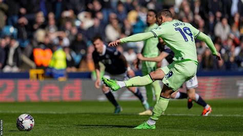 Swift penalty earns West Brom draw at Millwall .